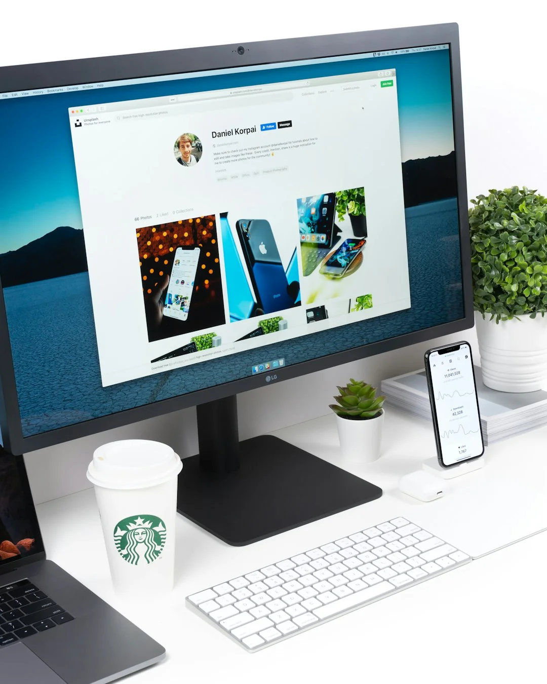 A bright desk setup featuring a design book, laptop, and creative tools, ideal for inspiration.